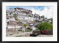 Framed Monks standing in front of the Thiksey Monastery, Leh, Ledakh, India