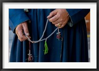 Framed Woman's hands holding prayer beads, Ladakh, India