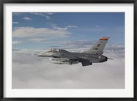 Framed F-16 Fighting Falcon Flies with AGM-65 Maverick Missile