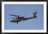 Framed AH-64 Apache in flight over the Baghdad Hotel in central Baghdad, Iraq