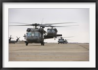 Framed UH-60 Black Hawks taxis out for a mission over northern Iraq