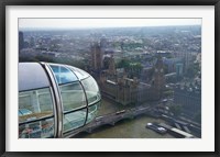 Framed London Eye as it passes Parliament and Big Ben, Thames River, London, England