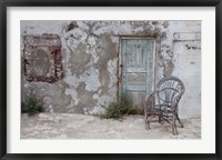 Framed Old Building chair and doorway in town of Oia, Santorini, Greece