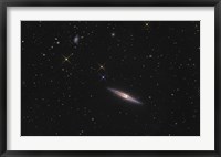 Framed NGC 4013 is an edge-on unbarred spiral galaxy in the Constellation Ursa Major