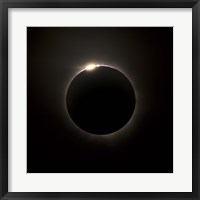 Framed Solar Eclipse with prominences and diamond ring effect