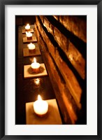 Framed Lighted Candles and Brick Wall