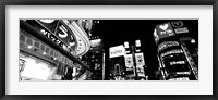 Framed Low angle view of buildings lit up at night, Tokyo, Japan