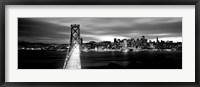 Framed Bridge lit up at dusk, Bay Bridge, San Francisco, California