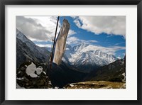 Framed Prayer flags on ridge above Dole, peak of Ama Dablam, Nepa,