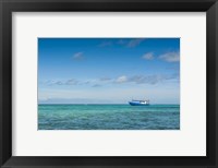 Framed Fishing boat in the turquoise waters of the blue lagoon, Yasawa, Fiji, South Pacific