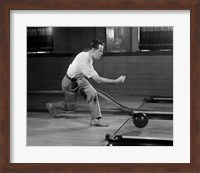 Framed 1950s Side View Of Man Bowling