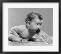 Framed 1950s Baby Leaning Forward Drinking From Bottle